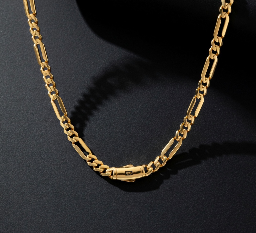 Original Monaco Figaro 22K gold chain flat lay dark background by Mari Jewellers Chilaw Sri Lanka